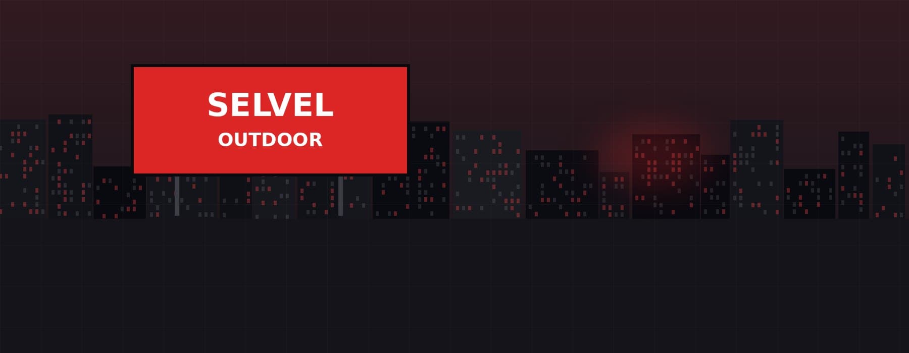 City skyline at night with illuminated advertising